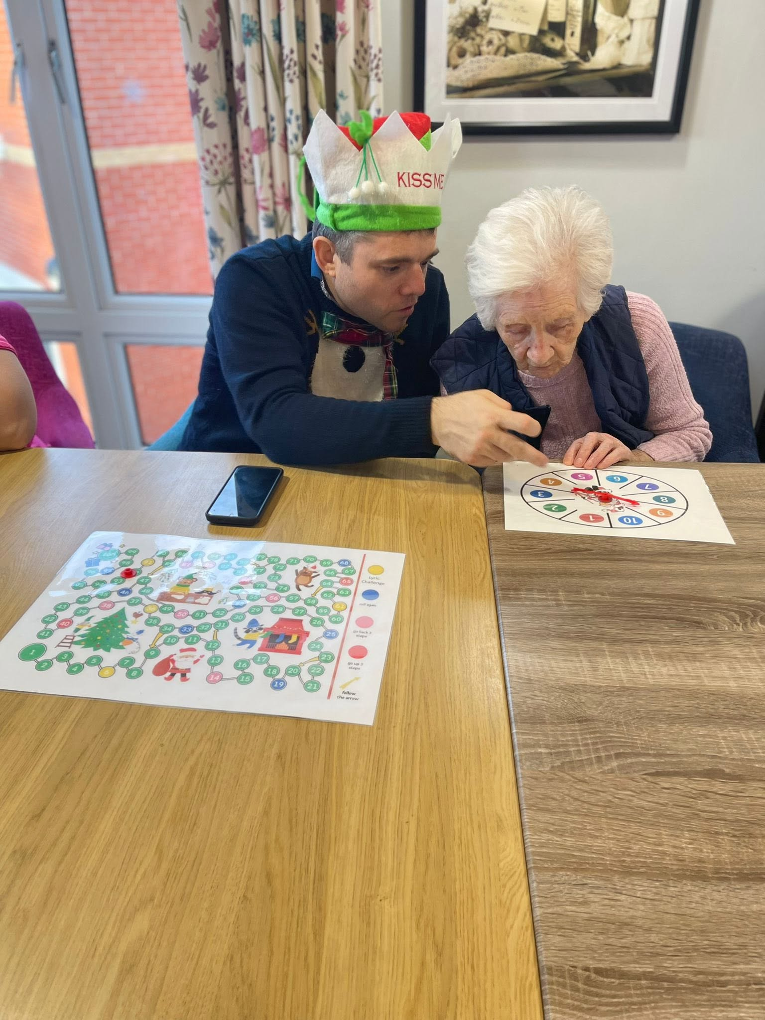 Alex playing a memory game with a resident