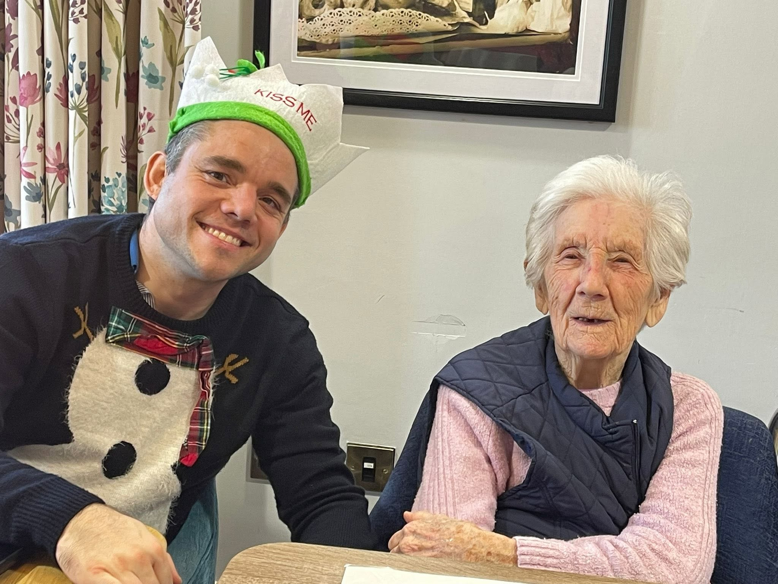 Alex with a resident during a Christmas Memory Club session